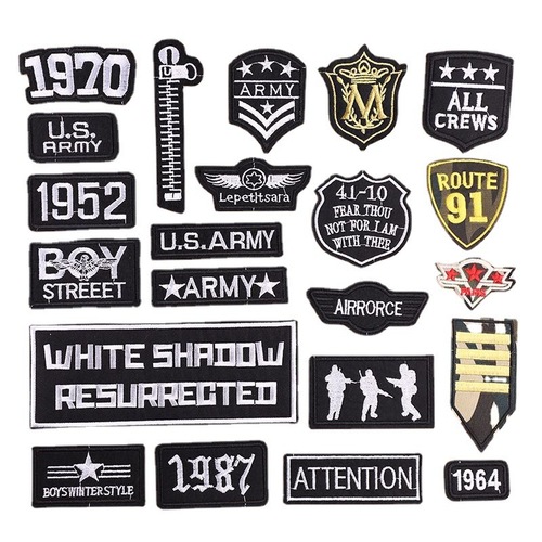 Embroidered patch with a small black logo, trendy for clothes and fashion accessories.