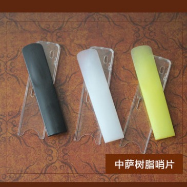 Agudos saxofón alto saxofón gota B Tubo negro resina silbato de plástico Tres colores disponibles