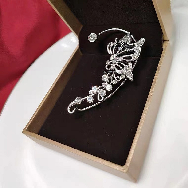 Tiktok mismo estilo mariposa percha de oreja diseño de nicho femenino versátil súper Hada colgador de oreja elfo incrustado en diamante sin clip de hueso de oreja perforado