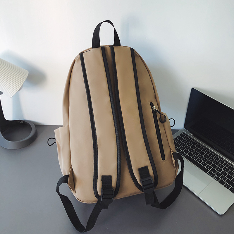 Nuevo estilo coreano en una pequeña mochila de color sólido fresco, mochila de gran capacidad, mochila de alto valor, mochila de estudiantes de moda.