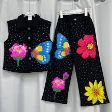 欧洲站蝴蝶花朵烫钻牛仔翻领时尚马甲+个性黑色牛仔直筒裤套装