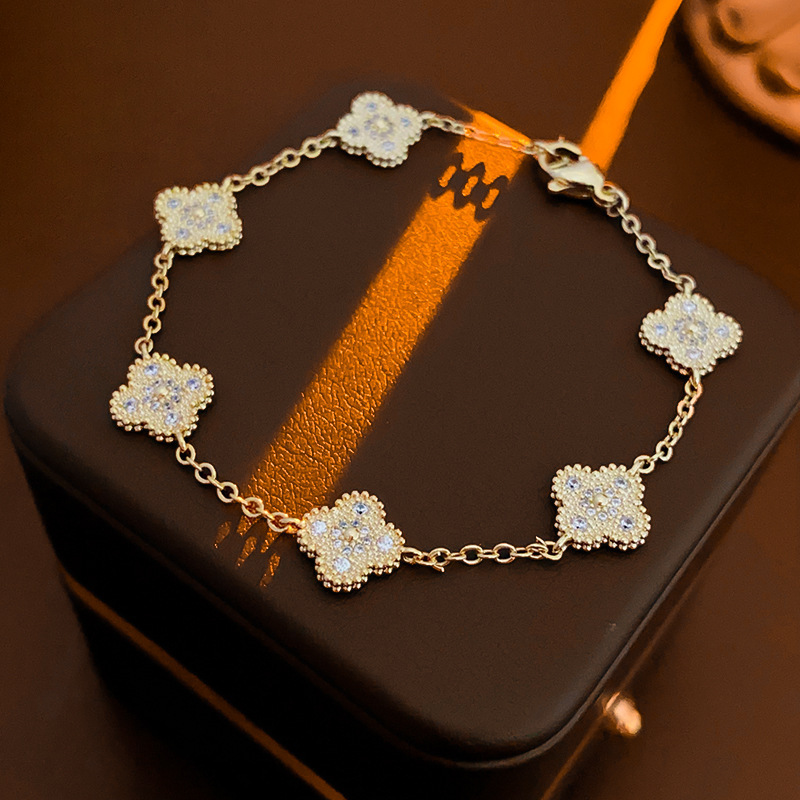 本物の金メッキジルコンの貝母の花のブレスレットはシンプルで、手の輪の軽い高級感のある手飾りの女性の卸売りです。|undefined