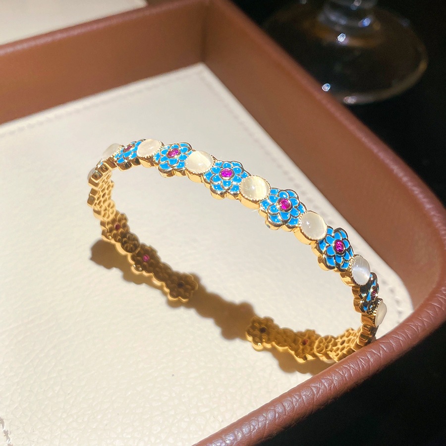 11 pulseras - doradas - azules