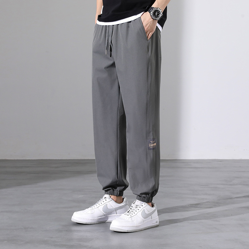 Pantalones deportivos para hombres pantalones casuales de tendencia sueltos de hielo de verano delgados nueve pantalones de patas pantalones para hombres al por mayor