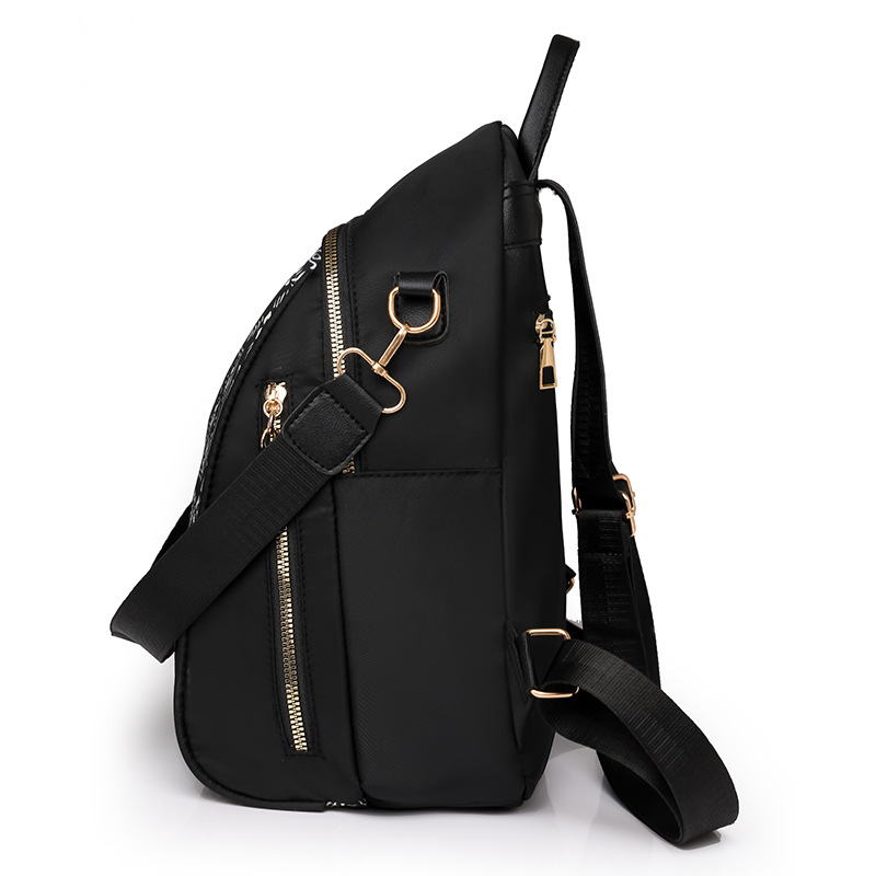 Bolsos para mujer 2023 nueva mochila de nylon para mujer coreana moda salvaje color de contraste mochila de viaje al aire libre al por mayor