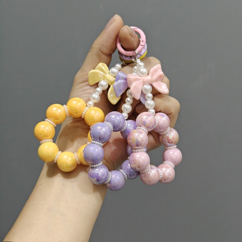 Nueva electrochapado cuentas arco llavero del coche colgante lindo caramelo color pintura anillo de perlas accesorios bolsa Decoración