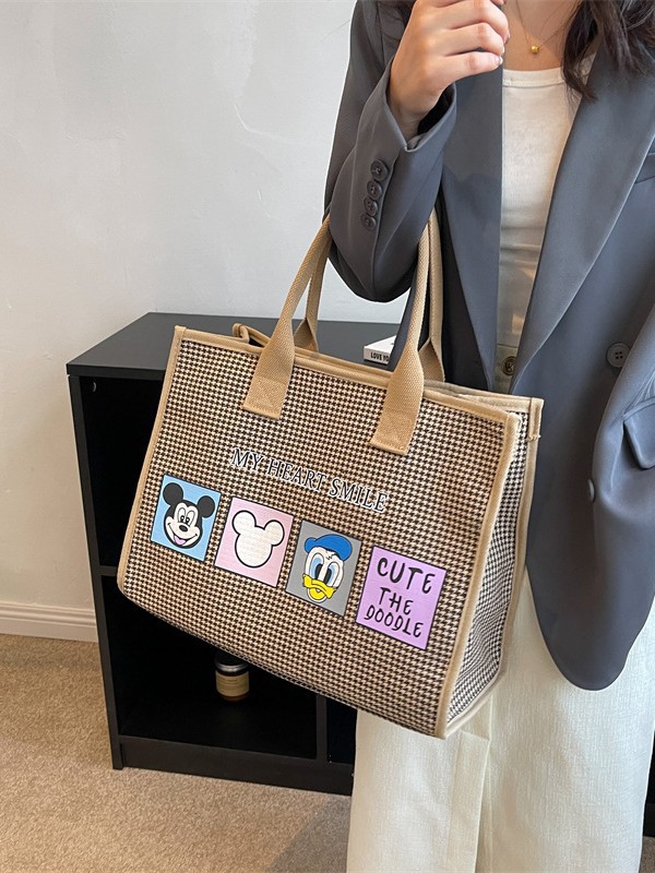 Bolso de mujer de alta sensación 2025 nuevo lienzo simple impresión de gran capacidad bolso de mano bolso de hombro de caricatura mamá