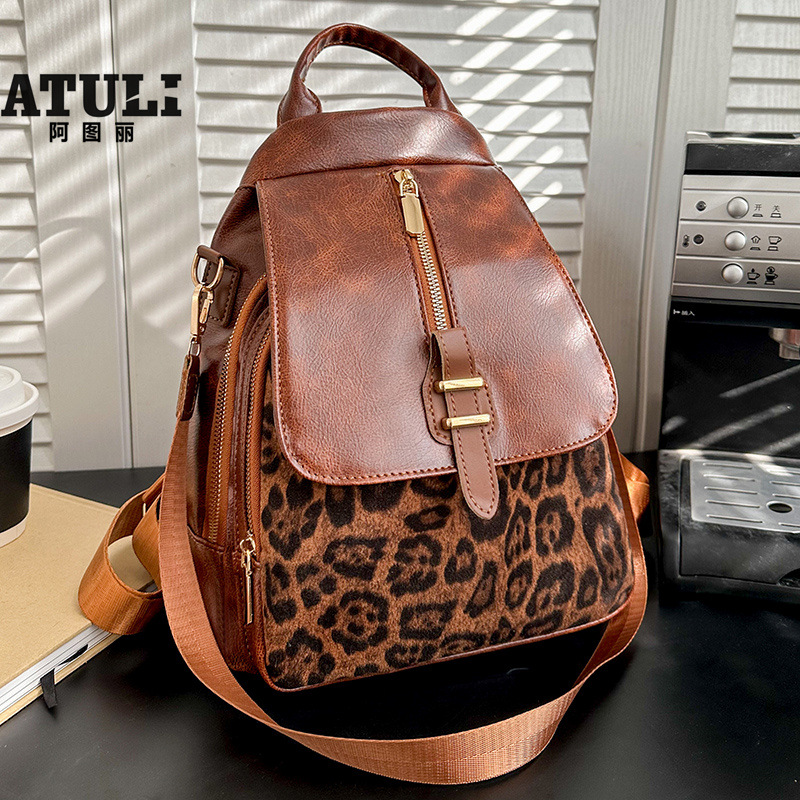 2025 primavera nuevo comercio exterior retro mochila casual impresión de tendencia de contraste de color moda al aire libre versátil gran capacidad