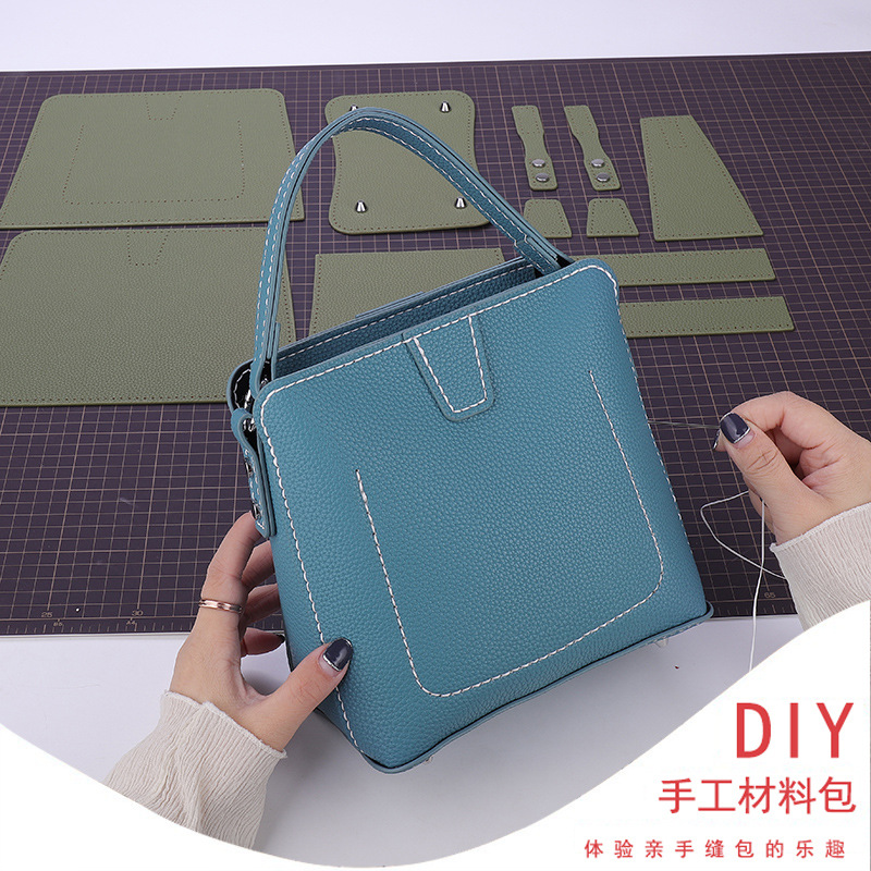 Shangxin 2021 nuevo paquete de material tejido de bricolaje hecho en casa bolso crossbody de un solo hombro bolsa de cubo de moda Fuente de Suministro