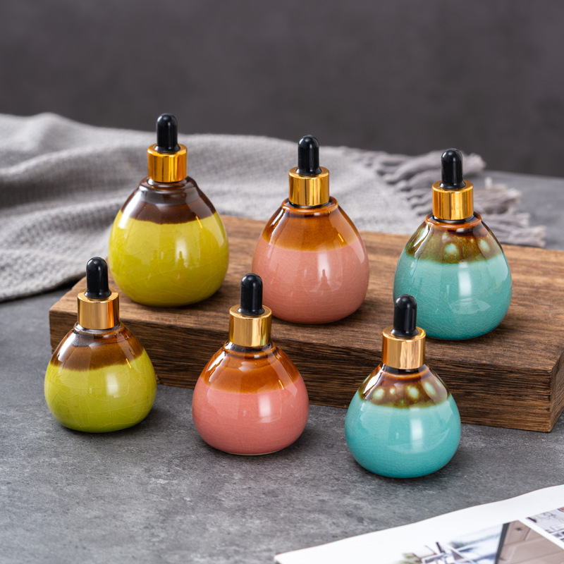 Cuentagotas de vidrio de alta calidad Esencia de aceite esencial de cerámica Cuidado de la piel botella salón de belleza spa tailandés aromaterapia spa botella de despliegue