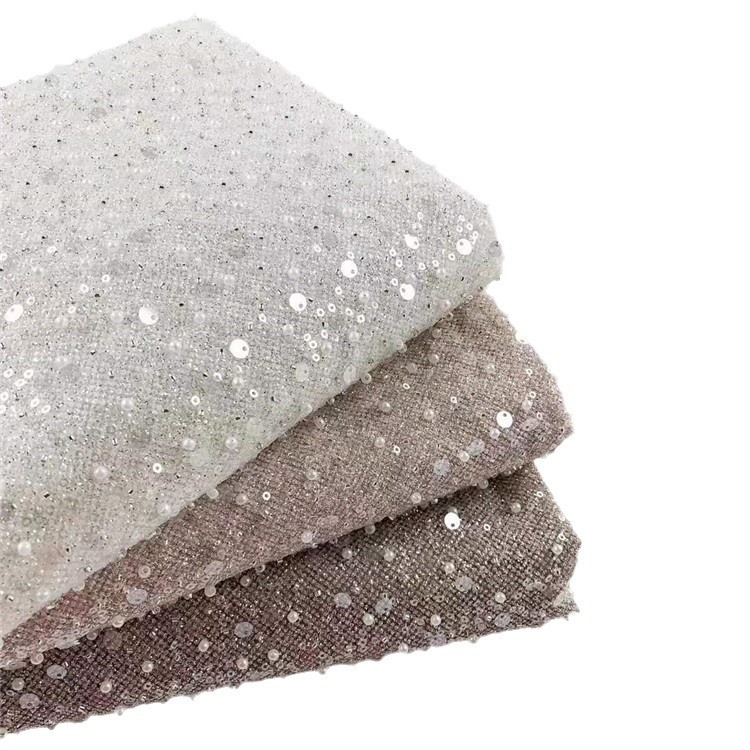 Fabricantes de comercio exterior transfronterizo punto bordado de polvo de polvo brillante tela vestido de boda ropa de moda tela