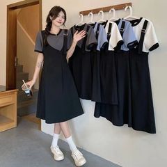 大きいサイズの太ったmmの夏のワンピースの新型の大衆のデザイン感はつなぎ合わせて色の偽の2つの肉を遮ってやせているスカートの女性を現します。