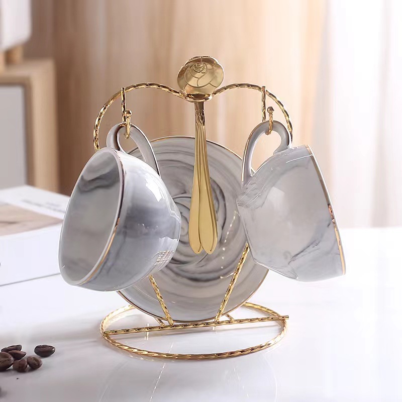 Luz de lujo taza de café traje de estilo europeo de alta apariencia taza y platillo taza de café de cerámica de alta gama exquisito juego de té de la tarde británica