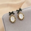 With bow, cat's eye