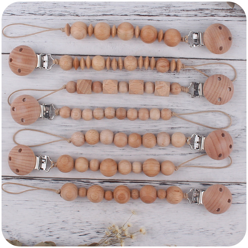 Nuevos suministros para bebés Beech clip calmante bebé Beech beads molar mordedura juguete anti-caída de la cadena Amazon