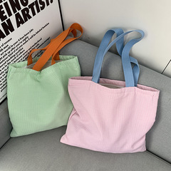 ストライプの色が小さくて清新でシンプルなキャンバスバッグです。