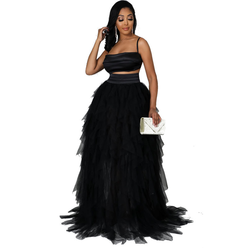 Vestido negro adelgazante de primavera y verano con un elegante y moderno conjunto de dos piezas con falda de pastel, falda de malla, estilo midi moderno y elegante.