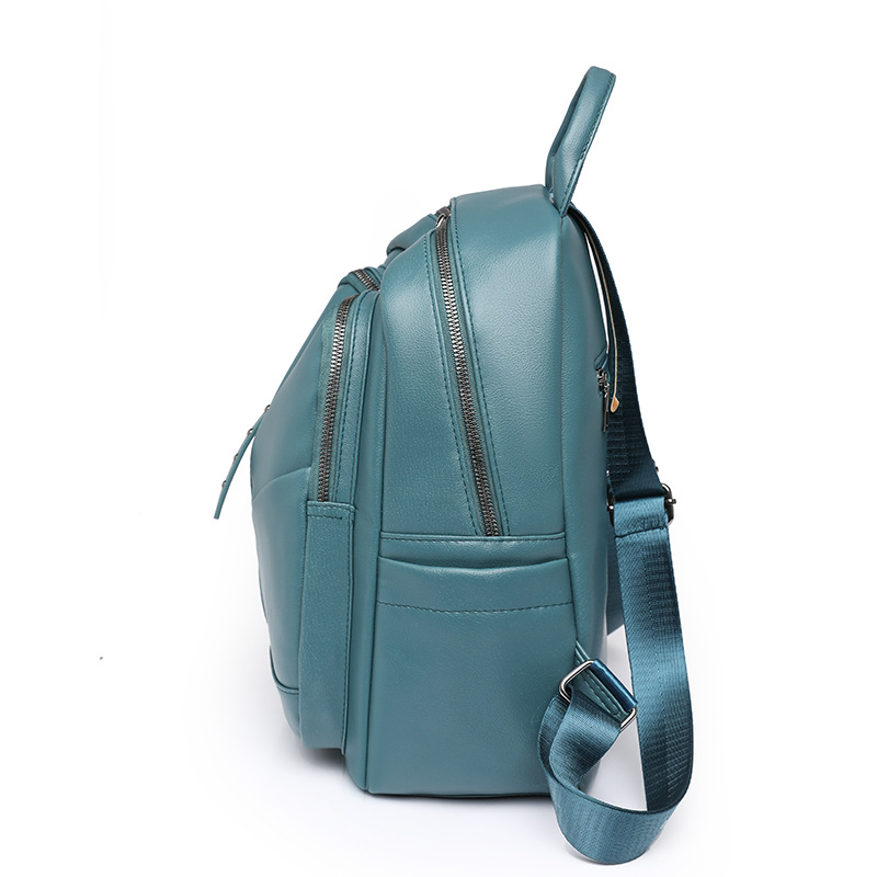 Fábrica al por mayor 2023 nueva mochila casual de cuero suave para mujer moda salvaje color sólido mochila de viaje al aire libre marea