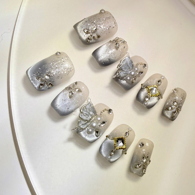 Foreign Trade Pure Handmade Cat-Eye Nail Tips with Silver-Plated Butterfly Carving and Rhinestone Decoration, Personalized Sweet and Cool Short Nail Pieces Foreign Trade Pure Handmade Cat-Eye Nail Tips with Silver-Plated Butterfly Carving and Rhinestone Decoration, Personalized Sweet and Cool Short Nail Pieces