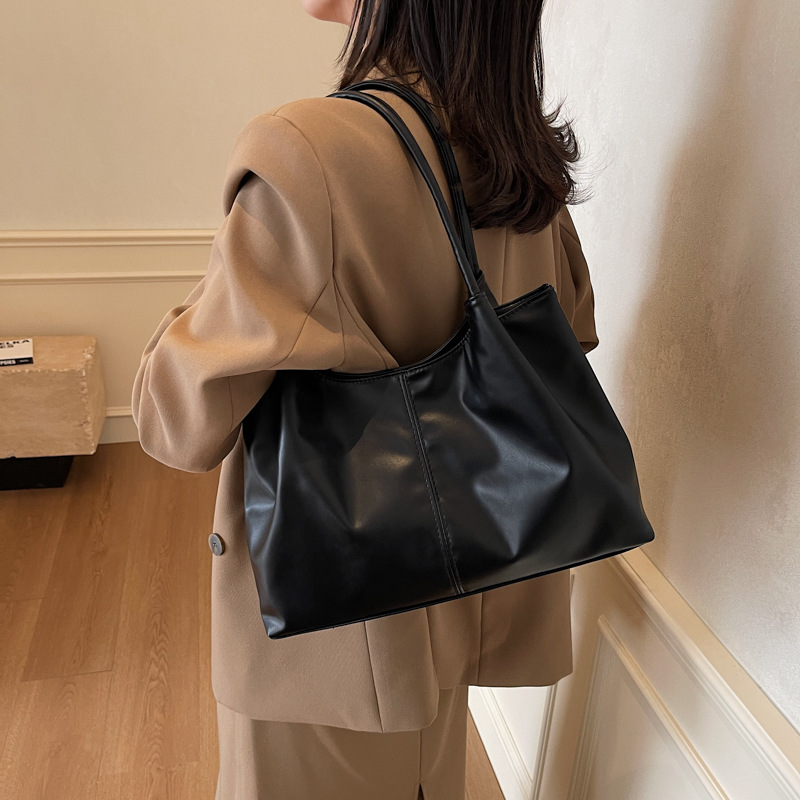 Baja de diseño de nicho popular este año, nicho japonés y coreano de gran capacidad, bolso de hombro para viajes diarios.