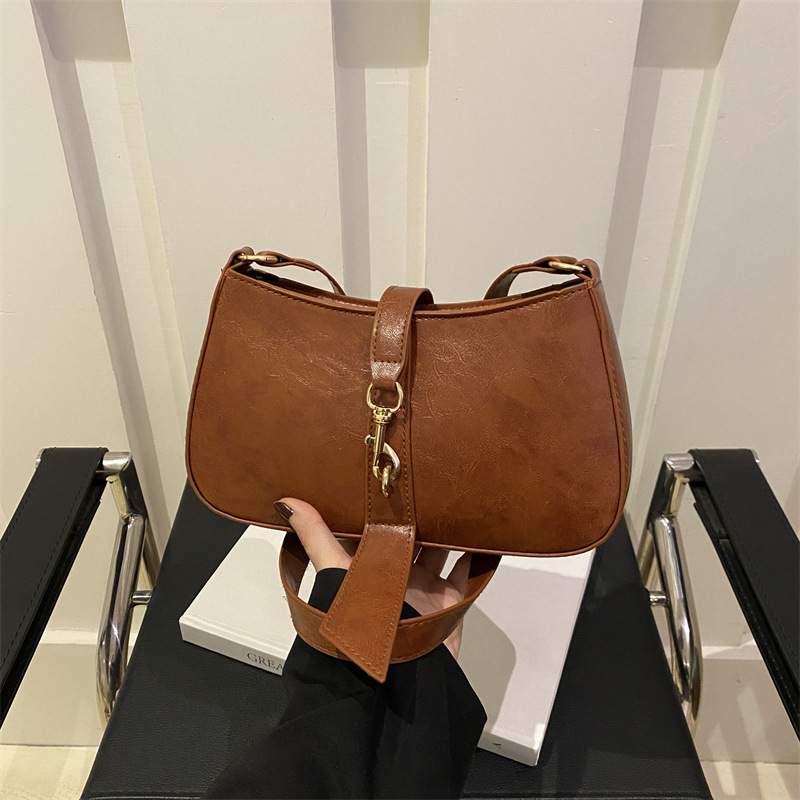 Bolsa de brazo francesa nicho para mujeres 2025 primavera y verano nueva moda moda personalidad bolso de palo estilo coreano bolso de hombro retro