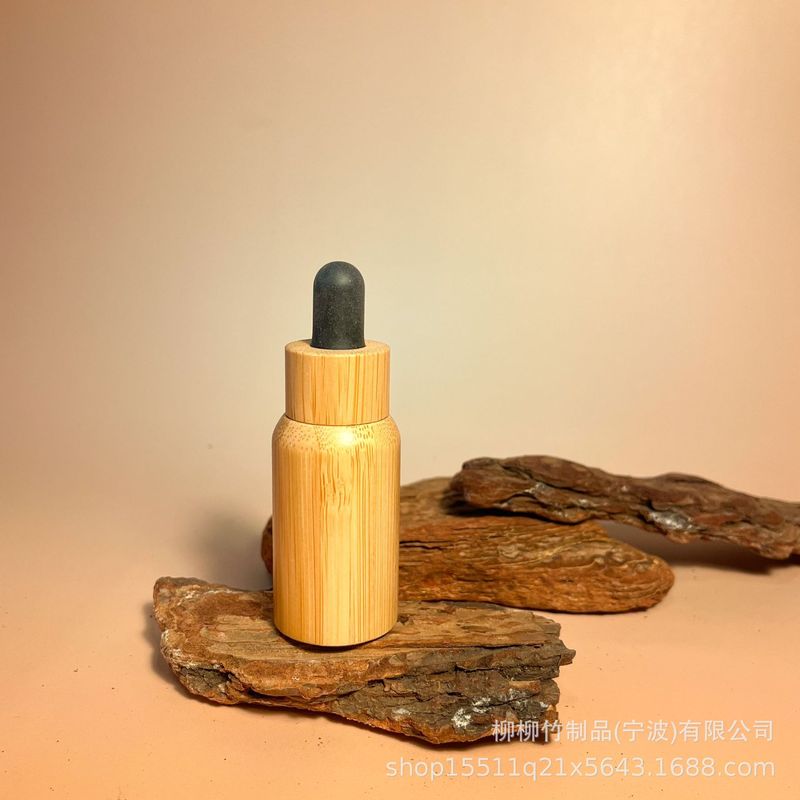 竹のゴムの頭の点滴の瓶の精華の液体の携帯は瓶の竹の製の光を避ける精華を分けて瓶の竹の木を分けて瓶を詰めます|undefined