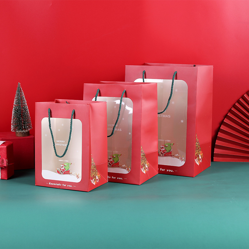 Bolsa de regalo de Navidad ventana transparente bolsa de papel portátil copo de nieve bolsa de papel Kraft exquisito embalaje bolsa de regalo en stock