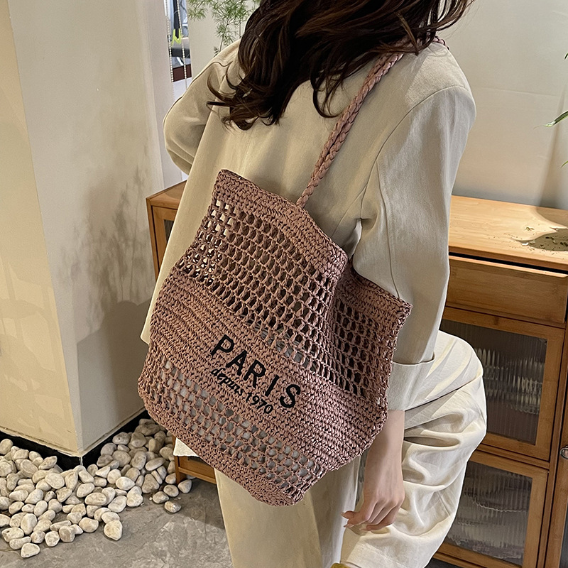 Bolso tejido de paja de moda casual para damas de gran capacidad 2025 nuevo bolso de hombro hueco tejido coreano bolso de playa