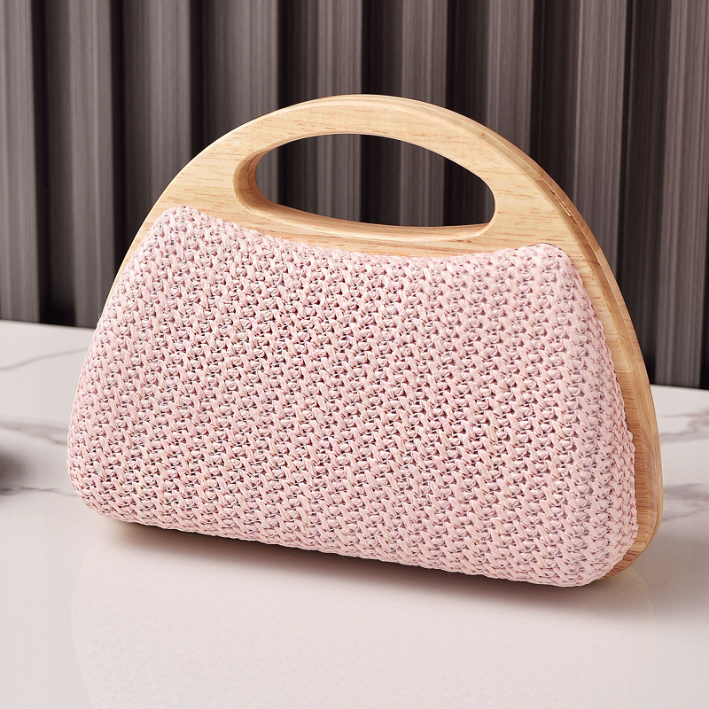 2025 nuevo bolso de mujer con clip de madera maciza tejido de paja bolso de verano de vacaciones junto al mar pequeño bolso de mujer fresco venta caliente transfronteriza