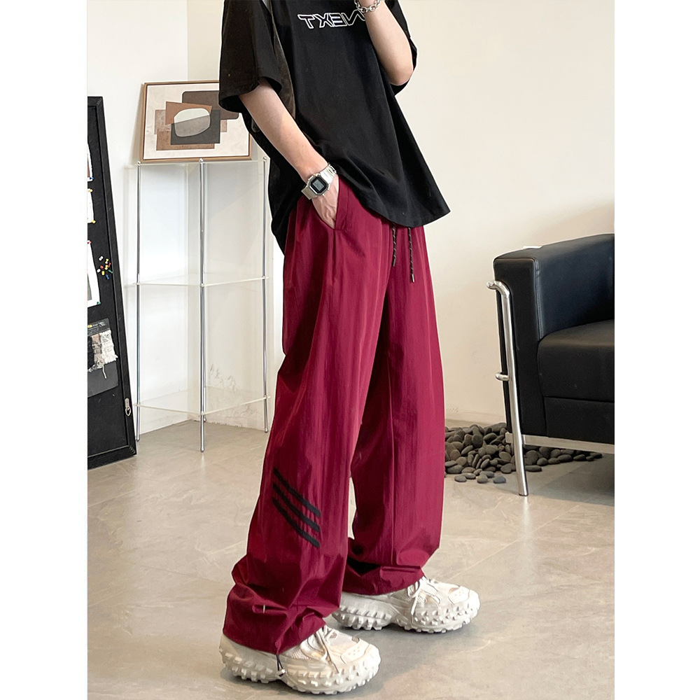 Pantalones de pierna ancha de secado rápido de calle alta estadounidense hombres y mujeres otoño nuevo casual suelto todo partido hip hop Rush pantalones moda masculina