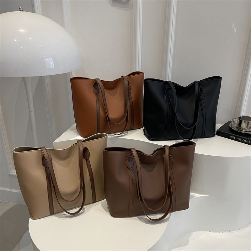 Bolso coreano de gran capacidad de alta calidad para mujeres 2025 nueva moda retro bolso de viaje tote simple bolso de hombro de color sólido