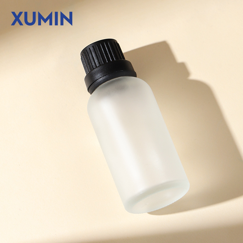 Botella de aceite esencial de vidrio de arena esmerizada al por mayor 30ml botella de muestra pequeña botella de embalaje de cosméticos portátiles