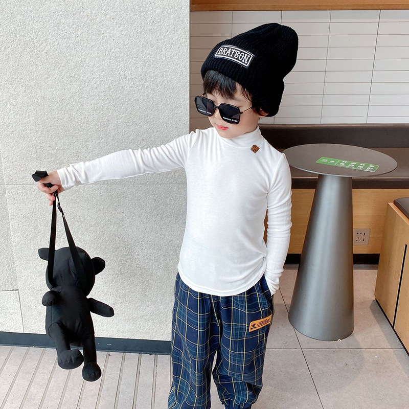 Ropa de otoño e invierno para niños nuevo estilo coreano color sólido camiseta de los muchachos medio cuello alto camisa de fondo para niñas engrosada bebé manga larga superior