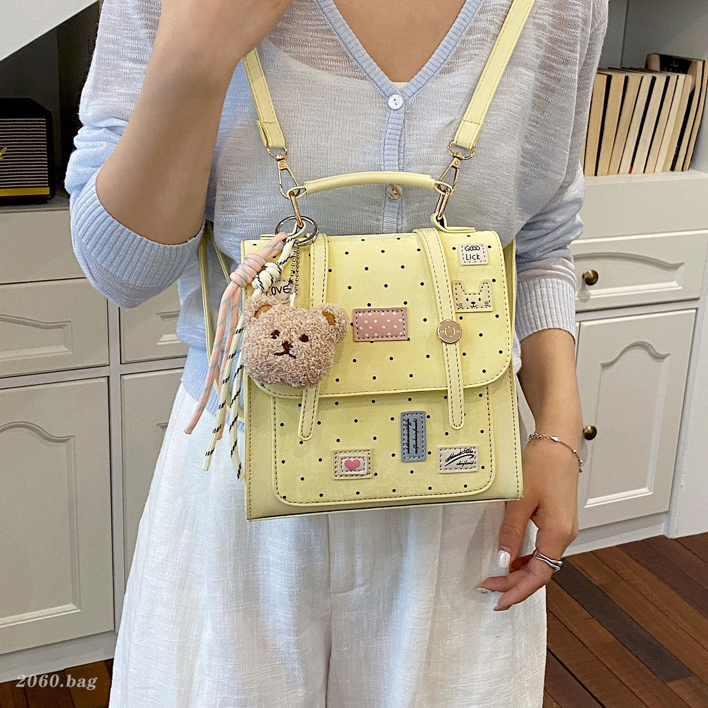 Mochila dulce chica de viaje universal clase de moda de punto de onda mochila de viento diaria 2026 nueva universidad femenina