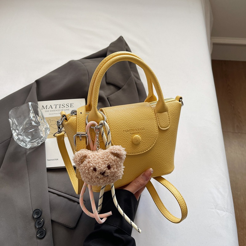 Bolsos pequeños de mano más vendidos de comercio exterior para mujer 2025 nuevo bolso cuadrado pequeño simple y todo fósforo textura casual bolso de mensajero de un solo hombro