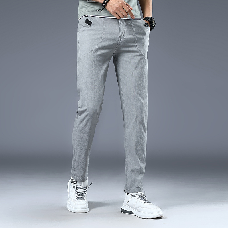 Four Seasons pantalones casuales elásticos para hombres al por mayor de los hombres jóvenes estilo coreano SLIM-Fit adelgazamiento simple moda lápiz pantalones hombres