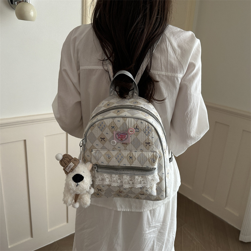 Mochila encantadora de moda coreana de mujer, alto valor de la cara, mochila de viaje diario, mochila universitaria universal.