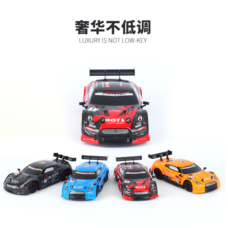 Transfronterizo de carga eléctrica de cuatro ruedas motrices RC deriva coche de control remoto 2,4g proporción aceleración carreras carrera de juguete de alta velocidad