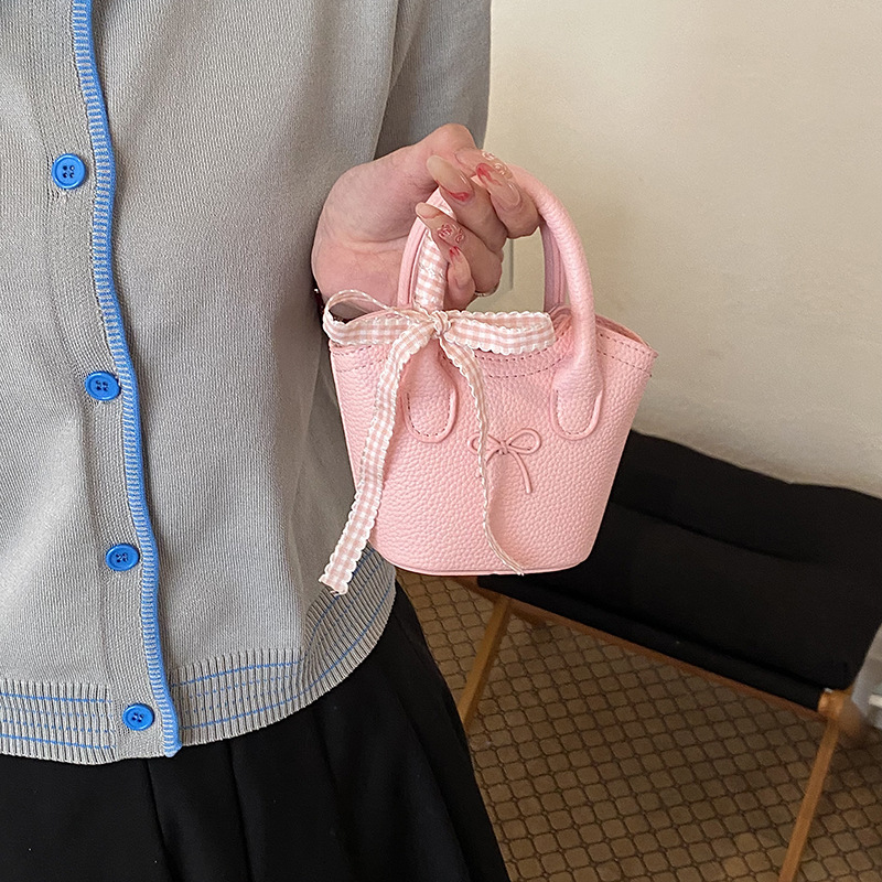 Nuevo bolso para niños coreano simple color sólido bolso de cubo para niños y niñas lindos arco mini bolso de mano bebé