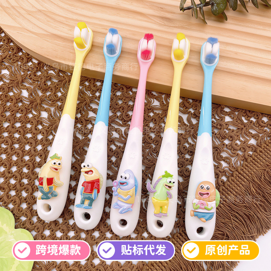 Children's toothbrush, suitable for ages 3-12, high-density bristles, manual operation, antibacterial, protects gums and teeth, Beach Castle design, cute fish pattern, soft bristles, premium quality