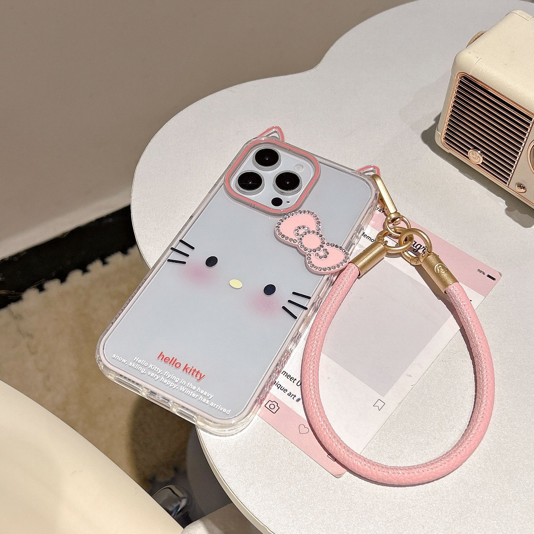 Nuevo lindo emoji KT para Apple 15/16 funda para teléfono móvil 14ProMax cuerda de mano 16PM femenino 15Pro nuevo 13