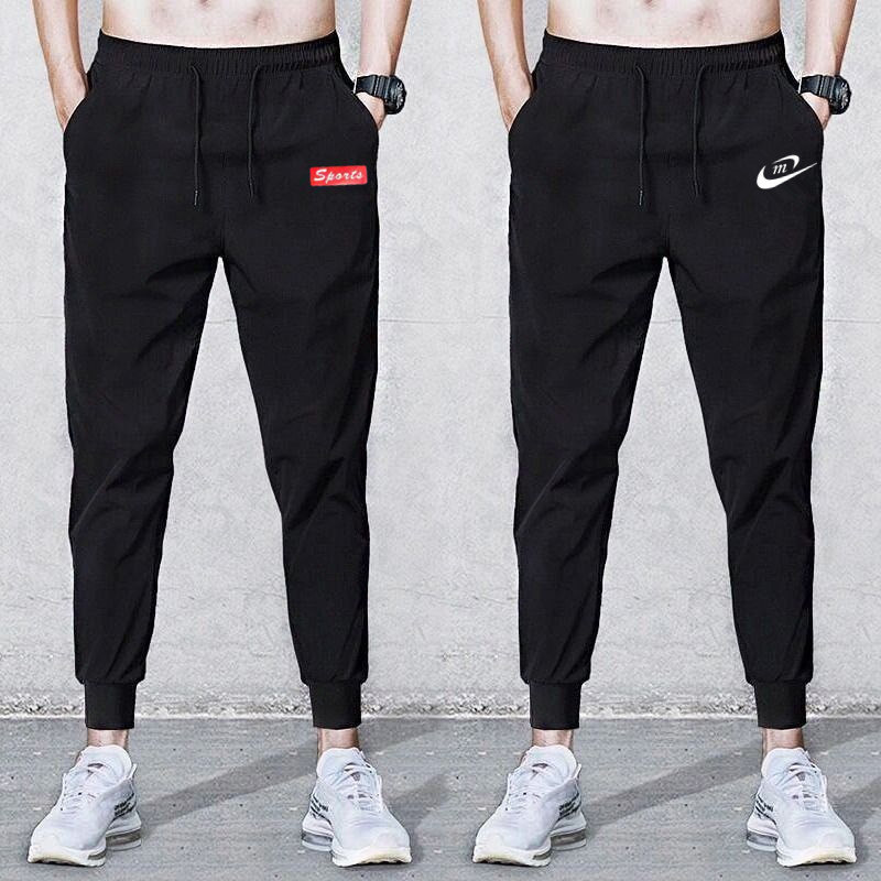 Factory wholesale sports casual pants men's loose toe Korean fashion black feet Harlan pants spring and autumn