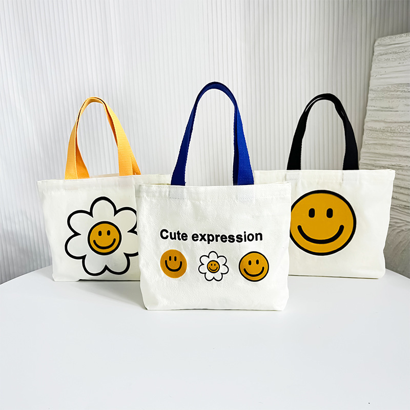 ファッションのキャンバスの小さい包みの女性のかわいい弁当は野菜の包みを買います2025春夏の新型の現物の子供のハンドバッグの日系|undefined