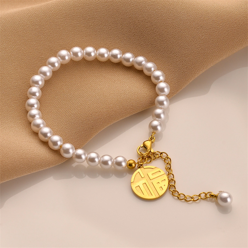 Ventas transfronterizas calientes de acero de titanio Fu marca imitación pulsera de perla mujer no decoloración brazalete de joyas de mano de diseño de alta gama al por mayor