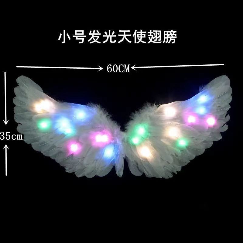 Alas de plumas luminosas blancas