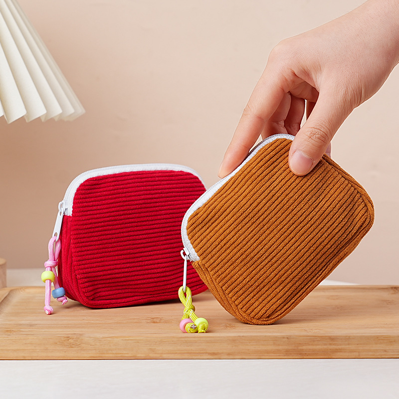 Nuevo bolso de cosméticos transfronterizo, bolso de almacenamiento de maquillaje de pana, monedero de estilo femenino, almacenamiento de toallas sanitarias, bolso portátil