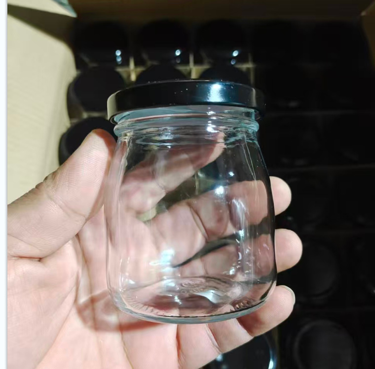 卸売り100mlガラス布丁瓶厚手牛乳カップ耐高温ヨーグルト瓶木栓ガラス瓶許瓶瓶