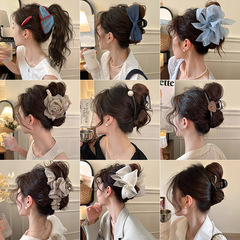 韓国系の優しい蝶結びで女性をつかみます。2025新型の甘いヘアピンの後頭部の高級感があります。