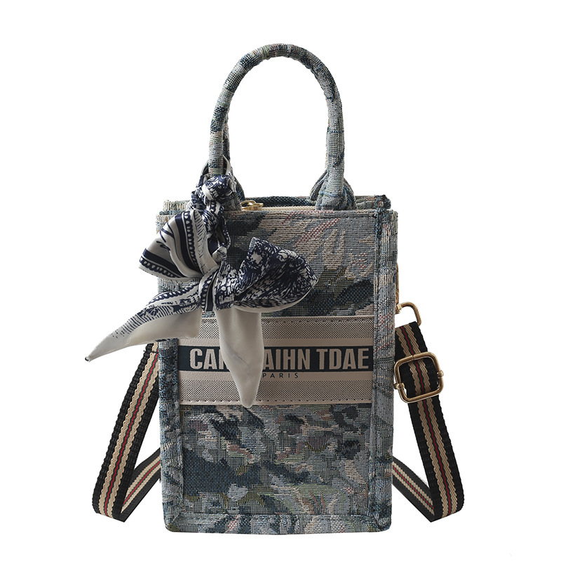 Bolso pequeño para mujer, nuevo bolso de mano vertical personalizado de moda europea y americana, bolso cruzado con estampado de lona de nicho