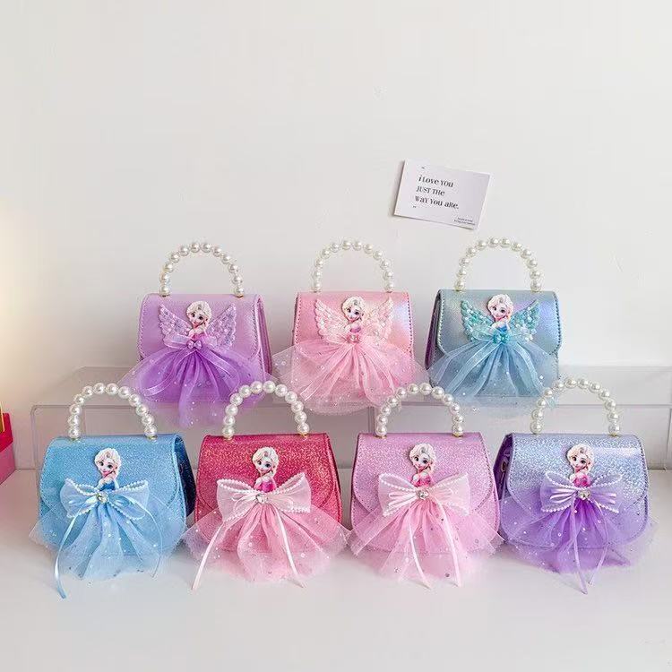 La niña transfronteriza Aisha bolso de hombro de este año, bolso de perla de moda popular, bolso de hombro para niños coreanos.